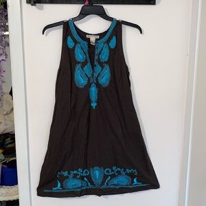 Large brown dress with teal paisley stitching along the top and bottom